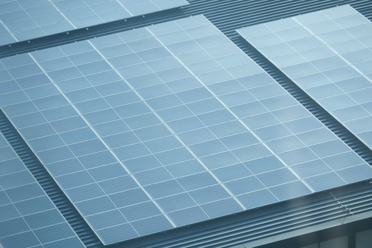 Close-up aerial view of solar panels properly installed on a residential roof in Hawaii