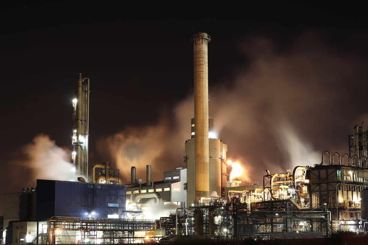 Thermal power plant burning petroleum at night — HECO operates similar facilities across Hawaii