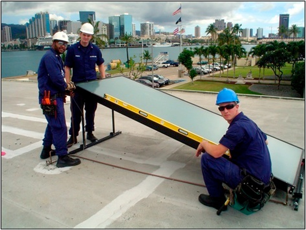 Military personnel installing solar panels at a Hawaii installation near Pearl Harbor