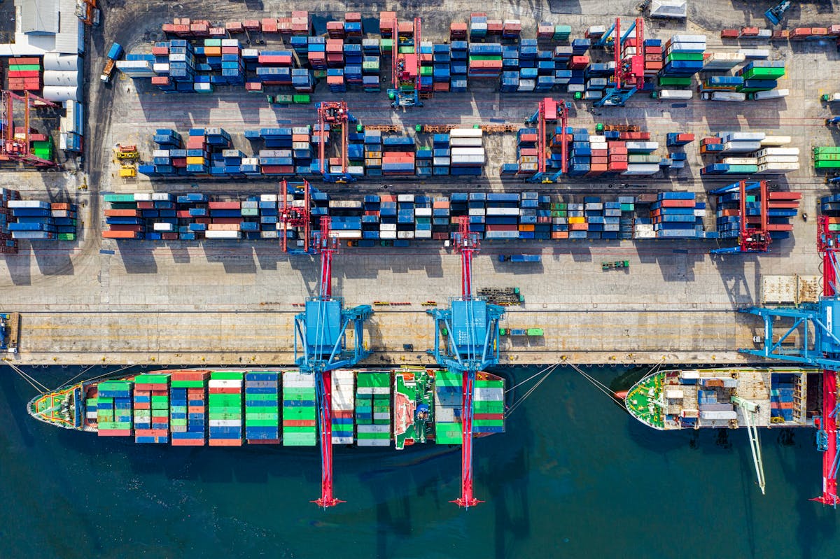 Aerial view of busy shipping port with cargo containers — Hawaii depends on this supply chain for fuel
