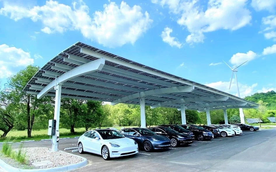 Commercial solar carport canopy with cars parked underneath