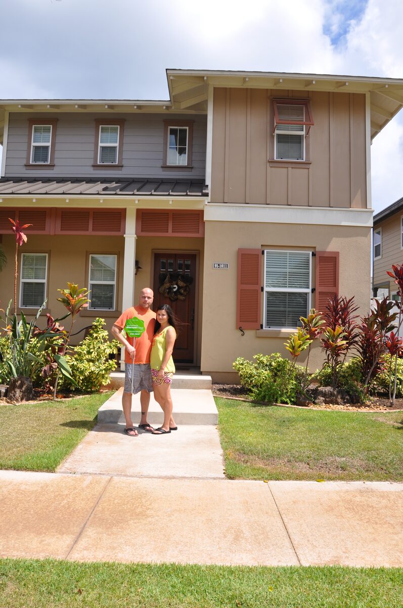Benros family in front of their home