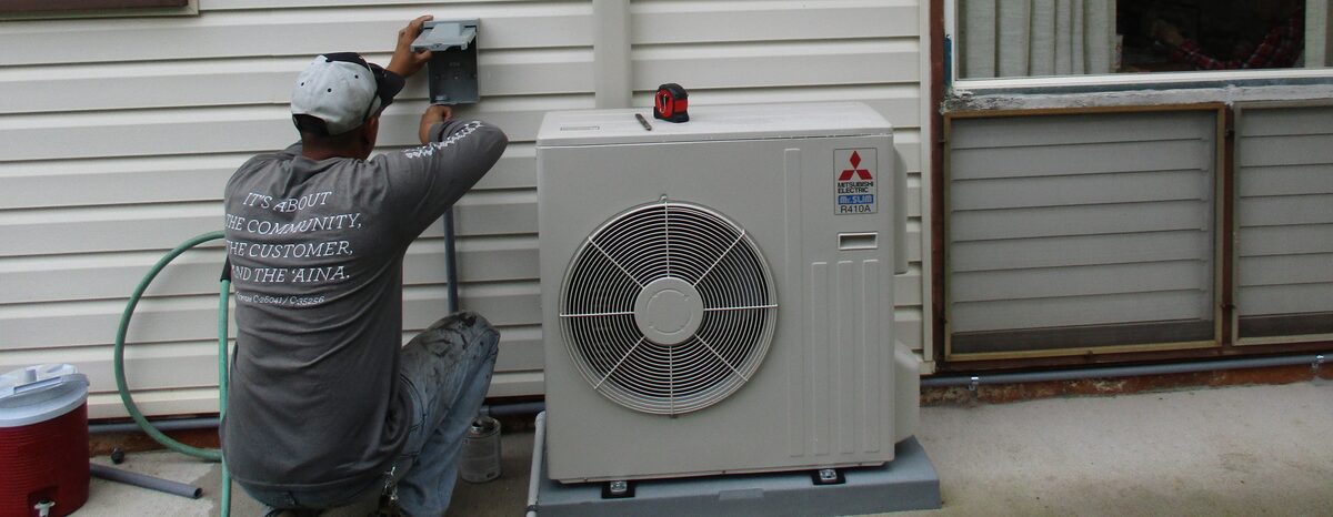 AEI technician installing Mitsubishi AC