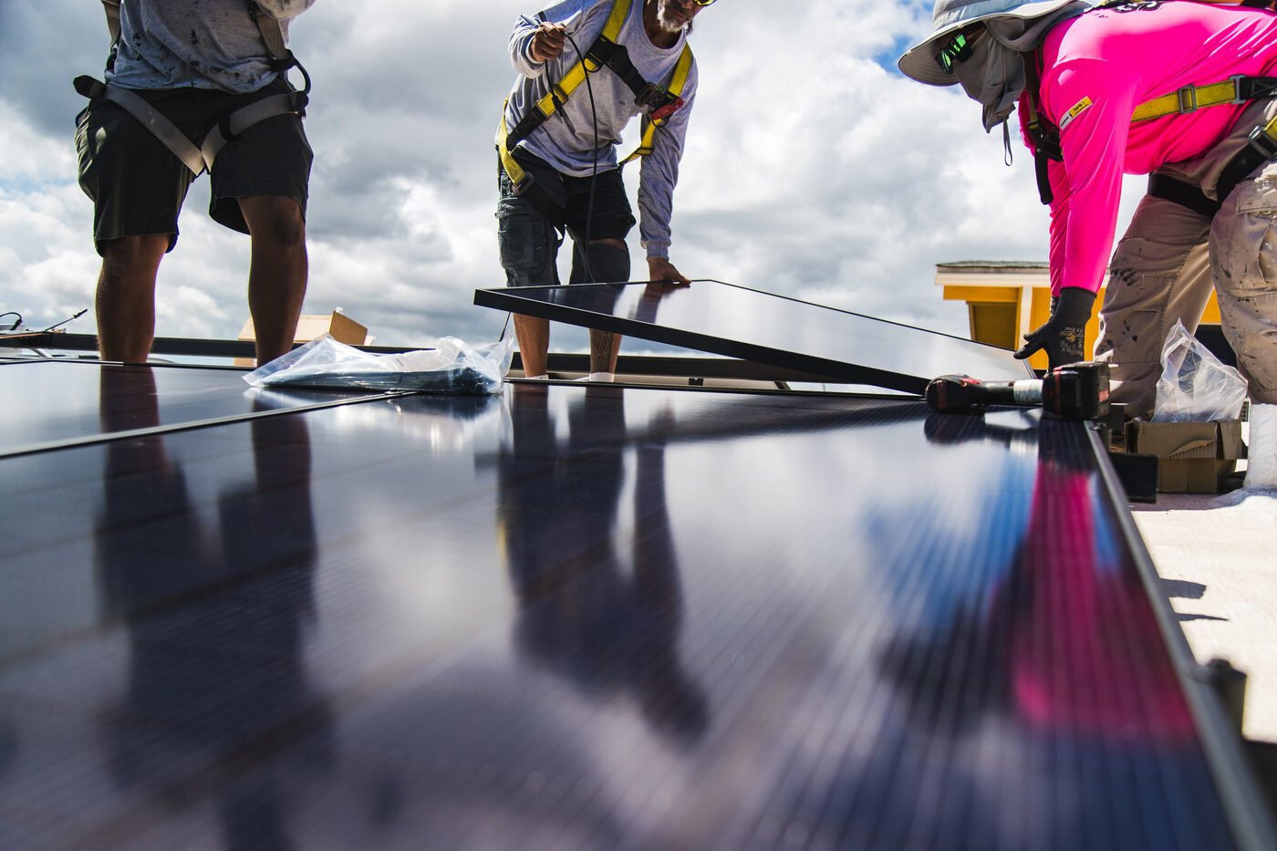 AEI crew installing solar panels on rooftop