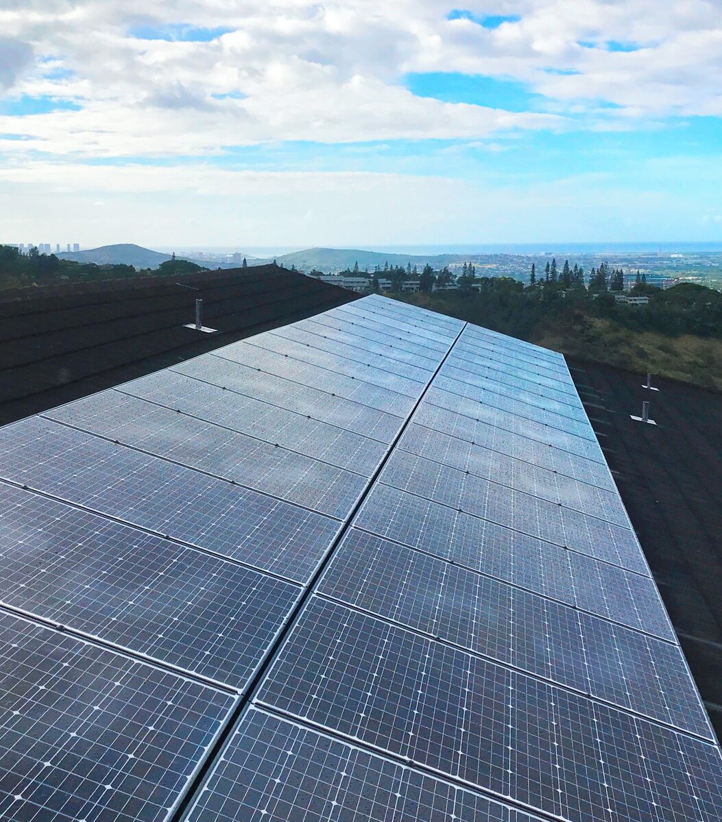 Modern rooftop solar panels representing current silicon technology that future perovskite cells aim to improve